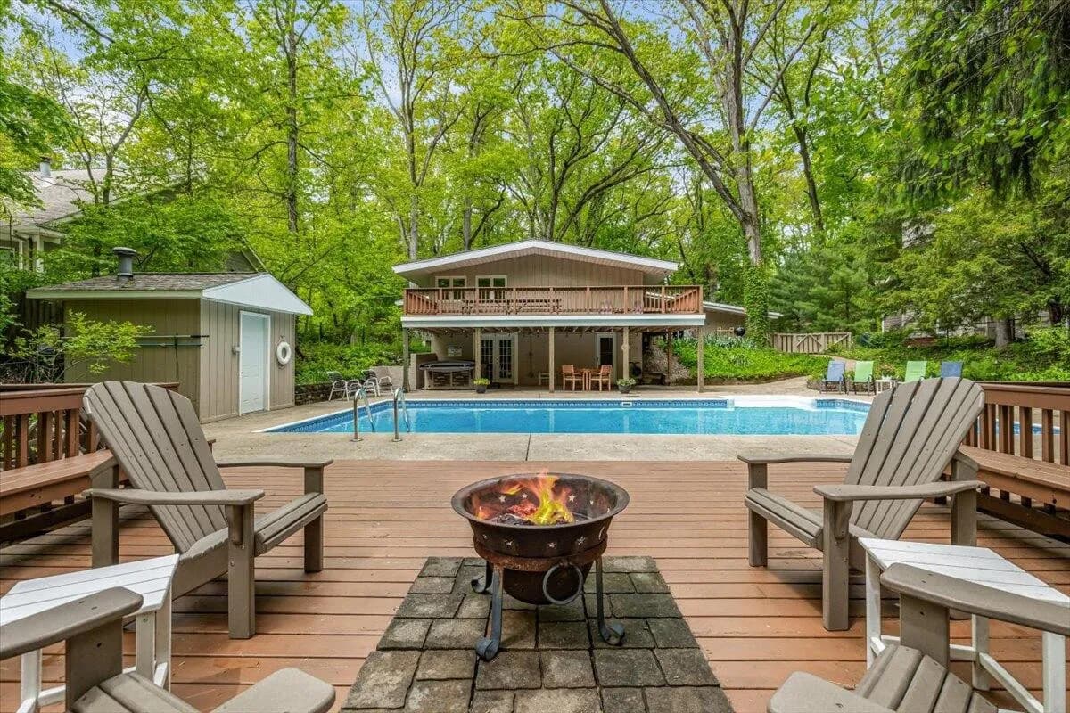 Stunning Pool Area with Fire Pit & Adirondack Chairs